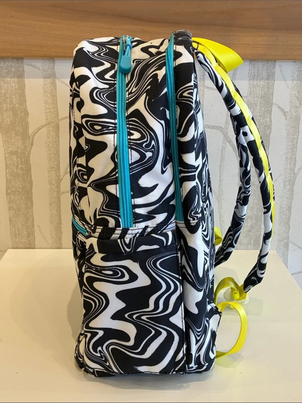 STATE Black & White Swirl Backpack with Pink Logo and Teal Accents
